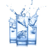 three glasses with splashing water three glasses with splashing water