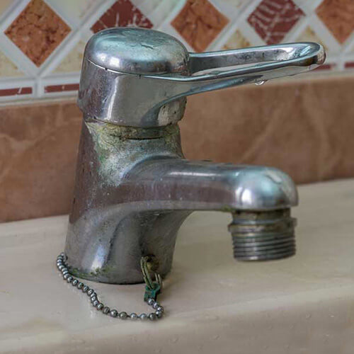 calcium buildup from hard water on a faucet