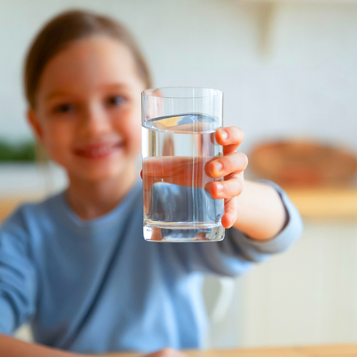 happy girl with glass of water