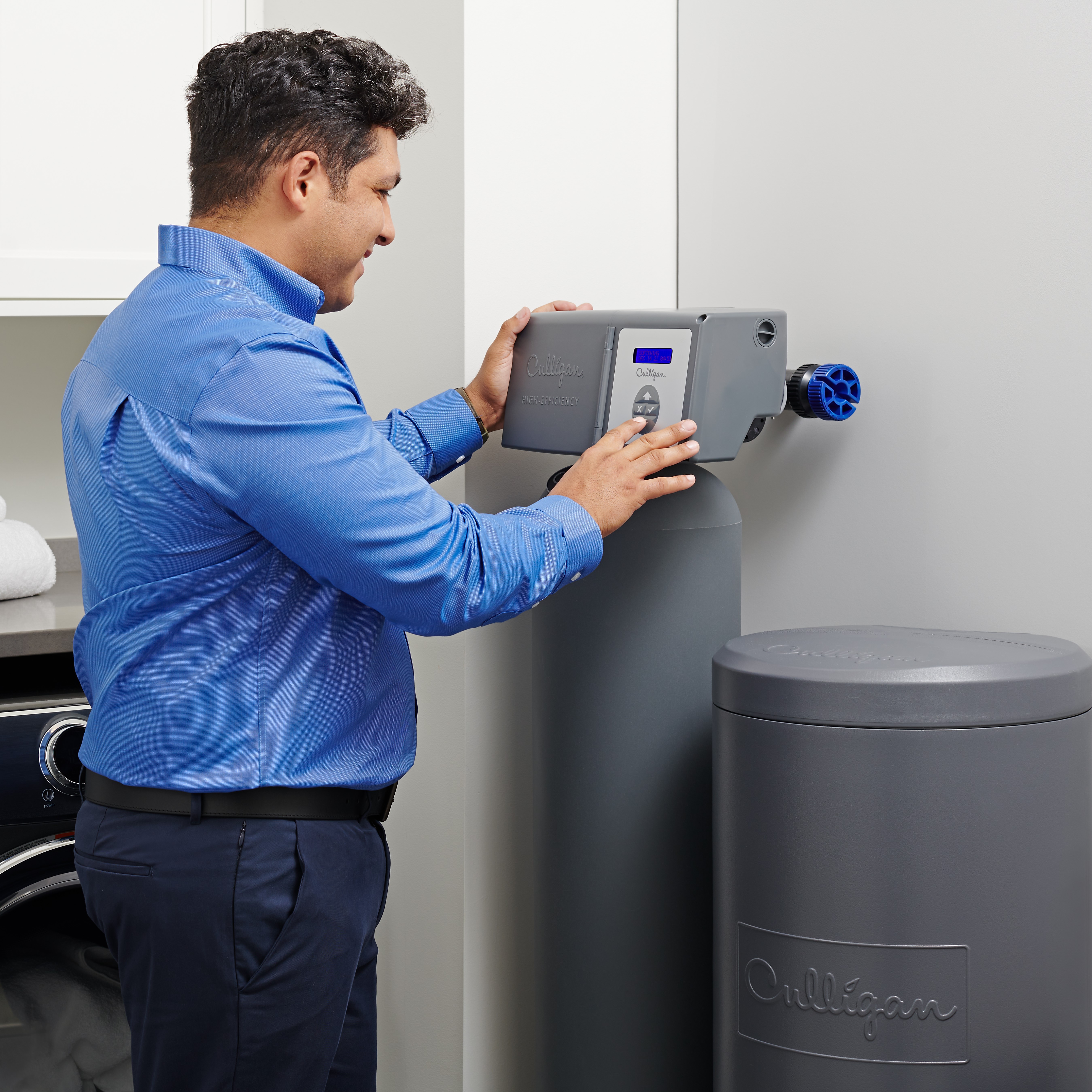 Culligan technician assisting with water softener maintenance